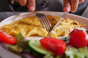 eating Plain Egg Omelette on table photo