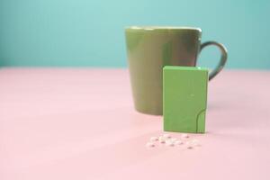 artificial sweetener container on table photo