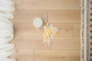 Spilled breakfast cereal on floor photo