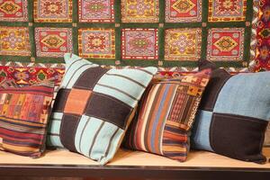 Colourful cushions on display for sale in a traditional Turkish Bazaar. photo