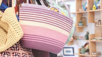 woolen pink and purple striped bag in a store video