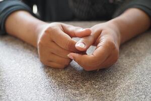 Young woman hands suffering pain in thumb finger photo