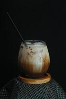 Chocolate milk with black background for using restaurant menu. photo