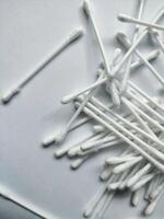 Cotton sticks isolated on the white paper background photo