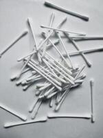 Cotton sticks isolated on the white paper background photo