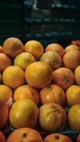 ai generado sabroso naranjas Fruta en monitor en comercio, Fresco Produce foto vertical móvil fondo de pantalla