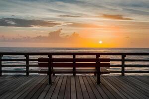 AI generated Unoccupied bench offers serene ocean view on pier photo