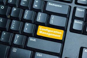 Configuration Management write on keyword isolated laptop background photo