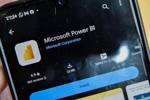 Microsoft Power BI application on Smartphone screen. Power BI is a freeware web browser developed by Microsoft Corporation. Bekasi, Indonesia, April 9, 2024 photo