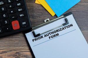 Concept of Prior Authorization Form write on paperwork isolated on wooden background. photo