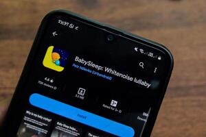 BabySleep application on Smartphone screen. Whitenoise Lullaby is a freeware web browser developed by Urbandroid. Bekasi, Indonesia, March 20, 2024 photo