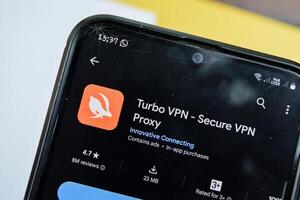 Turbo VPN application on Smartphone screen. Secure VPN Proxy is a freeware web browser developed by Innovative Connecting. Bekasi, Indonesia, March 24, 2024 photo