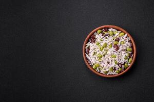 Delicious white cooked rice with green edamame beans with salt and spices photo