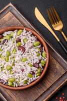 Delicious white cooked rice with green edamame beans with salt and spices photo