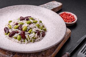 Delicious white cooked rice with green edamame beans with salt and spices photo