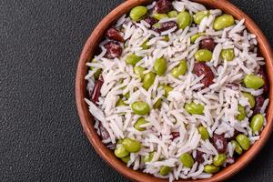 Delicious white cooked rice with green edamame beans with salt and spices photo