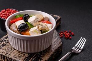 Delicious fresh juicy salad of sweet peppers, cheese, olives, tomatoes, cucumbers photo