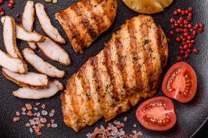 Delicious fresh grilled chicken fillet with spices and herbs photo