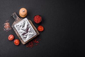 Rectangular plastic box with yogurt or cheese hermetically sealed with a foil lid photo