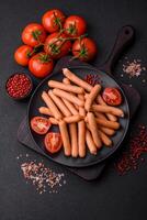 Delicious fresh small vegetarian sausages with salt, spices and herbs photo