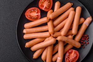 Delicious fresh small vegetarian sausages with salt, spices and herbs photo