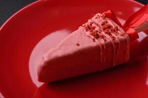 Delicious sweet cheesecake with fruits covered with icing with a wooden stick photo