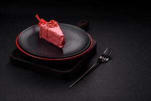 Delicious sweet cheesecake with fruits covered with icing with a wooden stick photo
