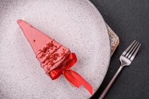 Delicious sweet cheesecake with fruits covered with icing with a wooden stick photo