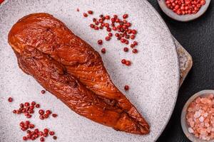Delicious smoked meat chicken breast with salt, spices and herbs photo