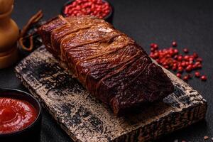 Delicious smoked meat pork or chicken with salt, spices and herbs photo