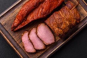 Delicious smoked meat pork or chicken with salt, spices and herbs photo