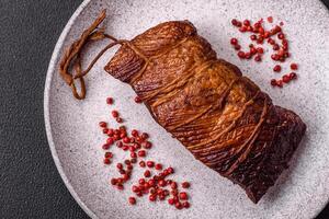 Delicious smoked meat pork or chicken with salt, spices and herbs photo