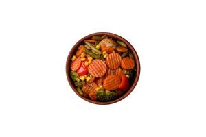 Delicious healthy vegetables steamed carrots, broccoli, asparagus beans and peppers photo