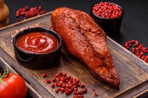 Delicious smoked meat chicken breast with salt, spices and herbs photo