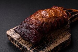 Delicious smoked meat pork or chicken with salt, spices and herbs photo