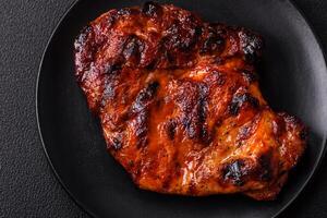 Fresh juicy delicious beef steak on a dark background photo