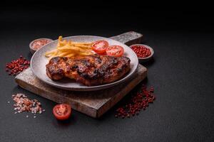 Fresh juicy delicious beef steak on a dark background photo