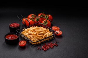 Delicious crispy golden fries with salt and spices photo