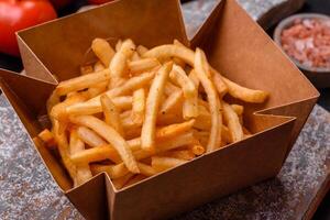 Delicious crispy golden fries with salt and spices photo