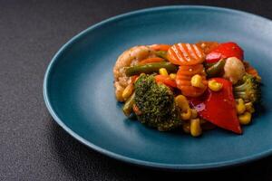 Delicious healthy vegetables steamed carrots, broccoli, asparagus beans and peppers photo