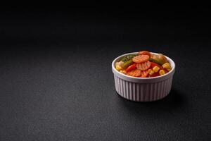 Delicious healthy vegetables steamed carrots, broccoli, asparagus beans and peppers photo