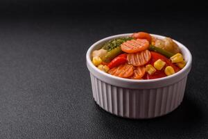Delicious healthy vegetables steamed carrots, broccoli, asparagus beans and peppers photo