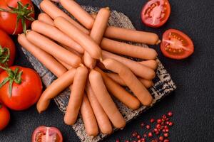 Delicious fresh small vegetarian sausages with salt, spices and herbs photo