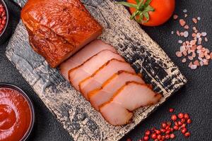 Delicious smoked meat chicken breast with salt, spices and herbs photo