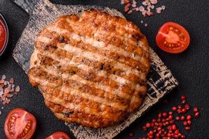 Delicious fresh grilled chicken fillet with spices and herbs photo