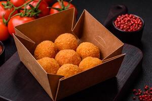 Delicious  balls of mozzarella and parmesan cheese with salt and spices photo