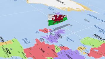 Wales vlag golvend in wind, wereld kaart roterend in de omgeving van vlag, naadloos lus, 3d renderen video