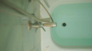 Close-up of a bathtub with running water from a faucet, focusing on cleanliness and bathroom fixtures. video