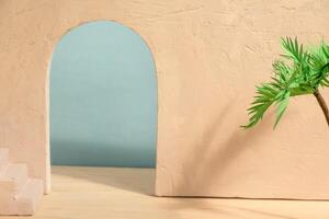 Concrete wall with arch, stairs and palm tree. Abstract interior summer background photo