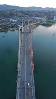 Aerial View of Iconic Merah Putih Cable Stayed Bridge accross Ambon Bay and Wai Ruhu Galala Yellow Truss Bridge video